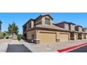 Attractive condo boasts private garages, easy access parking, neutral exterior tones and desert landscaping at 6868 Sky Pointe Dr # 2035, Las Vegas, NV 89131