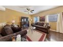 Cozy living room featuring comfortable seating, ceiling fan, and abundant natural light at 7701 W Robindale Rd # 274, Las Vegas, NV 89113