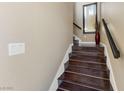 Stairway features attractive wood steps, leading upwards with a modern design and neutral color palette at 7701 W Robindale Rd # 274, Las Vegas, NV 89113