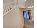 Hallway with staircase leading to second floor and door leading to balcony at 7856 Carysford Ave, Las Vegas, NV 89178