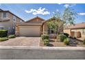 Charming single-story home with a two-car garage, paved driveway, and mature desert landscaping at 8346 Vinamala Ave, Las Vegas, NV 89149