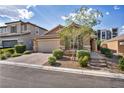 Charming single-story home featuring a paved driveway, desert landscaping, and a two-car garage at 8346 Vinamala Ave, Las Vegas, NV 89149