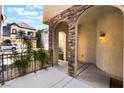 Inviting entryway with stone arches and a warm, welcoming ambiance, leading into a cozy home at 9236 Whitekirk Pl, Las Vegas, NV 89145