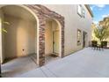 Private patio area perfect for outdoor dining with a small table set and comfortable seating at 9236 Whitekirk Pl, Las Vegas, NV 89145