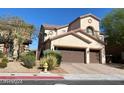 Attractive home with well-maintained landscaping, a tile roof, and an attached two-car garage at 9622 Staff Ln, Las Vegas, NV 89178