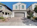 Inviting two-story home featuring a convenient two-car garage and a neatly paved driveway at , Henderson, NV 89011