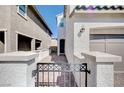 Close up of an entry gate leading to the front door, situated close to a private two-car garage at , Henderson, NV 89011