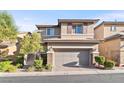 Charming two-story home with inviting front yard landscaping, stone accents, and a two-car garage at 10733 Red Badge Ave, Las Vegas, NV 89166