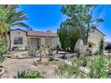Beautiful single-story home with drought-resistant landscaping in the front yard at 2402 Saguaro Point St, Las Vegas, NV 89115
