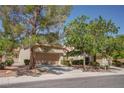 Charming single-story home with a two-car garage and mature trees in a well-maintained community at 2541 Desert Glen Dr, Las Vegas, NV 89134