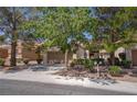 Charming single-story home with a two-car garage and mature trees in a well-maintained community at 2541 Desert Glen Dr, Las Vegas, NV 89134