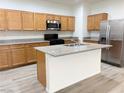 Spacious kitchen island with stainless steel appliances and wooden cabinetry at 3165 Beltrada Ave, Henderson, NV 89044