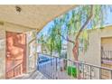 Balcony with gray metal railing showcasing the outside neighborhood at 3221 Jericho St # D, Las Vegas, NV 89102
