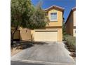 Two-story house featuring a two-car garage, driveway, and partial tree coverage at 3508 Harbor Tides St, Las Vegas, NV 89147
