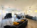 Open-concept living room and kitchen area with modern design at 3508 Harbor Tides St, Las Vegas, NV 89147