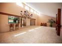 Spacious living room with tile floors, high ceilings, and stylish chandelier at 3790 W Moberly Ave, Las Vegas, NV 89139