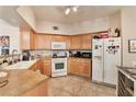 Functional kitchen with linoleum floors, complete with essential appliances and cabinetry at 3975 N Hualapai Way # 121, Las Vegas, NV 89129