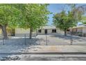 Well-maintained single-story home with a gravel front yard and chain-link fence at 4424 Sunrise Ave, Las Vegas, NV 89110