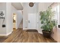 Welcoming foyer with hardwood floors, high ceilings, and a staircase at 5131 Moose Falls Dr, Las Vegas, NV 89141