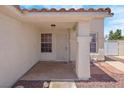 Inviting front porch with decorative pillars and security door, providing curb appeal at 519 Landra Ln, Henderson, NV 89015