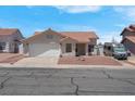 Charming single-story home featuring a well-manicured front yard and a two-car garage at 519 Landra Ln, Henderson, NV 89015