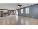 Bright living room with tile floors, open to the kitchen with a breakfast bar at 599 Wounded Star Ave, Las Vegas, NV 89178