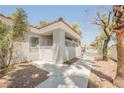Charming condo exterior with a landscaped front yard and pathway leading to the entrance at 6006 Vegas Dr, Las Vegas, NV 89108