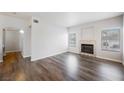 Open living room with a fireplace and modern flooring at 6006 Vegas Dr, Las Vegas, NV 89108