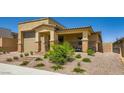 Inviting front exterior showcasing desert landscaping, a covered entryway, and a neutral color scheme at 6098 Avery Pointe St, Las Vegas, NV 89166