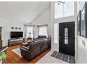 Inviting foyer with hardwood floors, high ceilings, and a stylish front door with sidelights at 6746 Shelter Ln, Las Vegas, NV 89103