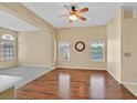 Spacious living area with hardwood floors, ceiling fan, and plenty of natural light at 6920 Haven Hollow Ave, Las Vegas, NV 89130