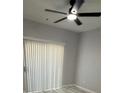 Bedroom with a ceiling fan and lots of light from the sliding glass door at 6955 N Durango Dr # 1013, Las Vegas, NV 89149