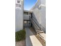 Exterior apartment building entrance with stairway leading to the upper level unit at 6955 N Durango Dr # 2054, Las Vegas, NV 89149