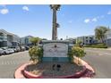 Welcoming entrance to The Regent at Town Center with mature landscaping and clear signage at 6955 N Durango Dr # 2054, Las Vegas, NV 89149