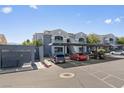 Apartment complex exterior with parking, covered parking spots, and well-maintained landscaping at 6955 N Durango Dr # 2054, Las Vegas, NV 89149