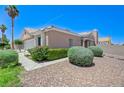 Charming home featuring desert landscaping, a two-car garage, and a well manicured front yard at 7019 Shadow Crest Dr, Las Vegas, NV 89119