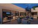 A spacious rooftop patio with comfortable seating, a spiral staircase, and views at 120 Still Shores St, Henderson, NV 89011