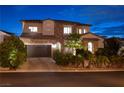 Charming two-story home with a beautifully landscaped front yard and manicured palm trees at 29 Costa Tropical Dr, Henderson, NV 89011