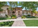 Elegant single-story home featuring manicured landscaping, stone details, and a welcoming entrance at 38 Pebble Dunes Ct, Las Vegas, NV 89141