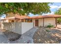 Charming one-story home featuring a tile roof, stucco walls, and desert landscaping at 5101 Renault Ave, Las Vegas, NV 89142