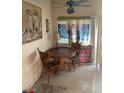 Cozy dining room with vintage-style wooden chairs, tile floors, and a ceiling fan at 5429 Chela Dr, Las Vegas, NV 89120