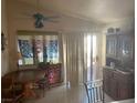 Inviting dining area with tiled floors, natural light from a glass door, and adjacent to the kitchen at 5429 Chela Dr, Las Vegas, NV 89120