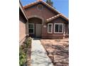 Single-story home with desert landscaping, covered front porch and charming architecture at 6704 Lost River Ct, Las Vegas, NV 89108