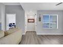 Bright living room with neutral walls and grey flooring at 7100 Pirates Cove Rd # 2076, Las Vegas, NV 89145