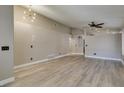 Bright living room featuring vaulted ceiling, ceiling fan, and modern flooring at 87 Ginger Lily Ter, Henderson, NV 89074