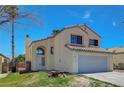 Charming two-story home featuring desert landscaping and a two-car garage, complete with a tile roof at 901 Carnival Ave, Las Vegas, NV 89123