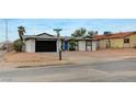 Charming single story house with a black garage door and low maintenance landscaping at , Henderson, NV 89015