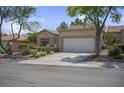 Charming single-story home with well-maintained desert landscaping and a two-car garage at 10017 Bundella Dr, Las Vegas, NV 89134