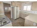 View of kitchen with ample counter space, tile floors and modern appliances at 1349 Goldenglow Rd, Las Vegas, NV 89108