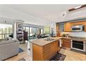 Bright, open kitchen with granite countertops, stainless steel appliances, and a breakfast bar at 222 Karen Ave # 3305, Las Vegas, NV 89109